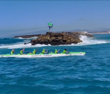 Image of Jett in an Outrigger canoe in the PaoPao Race